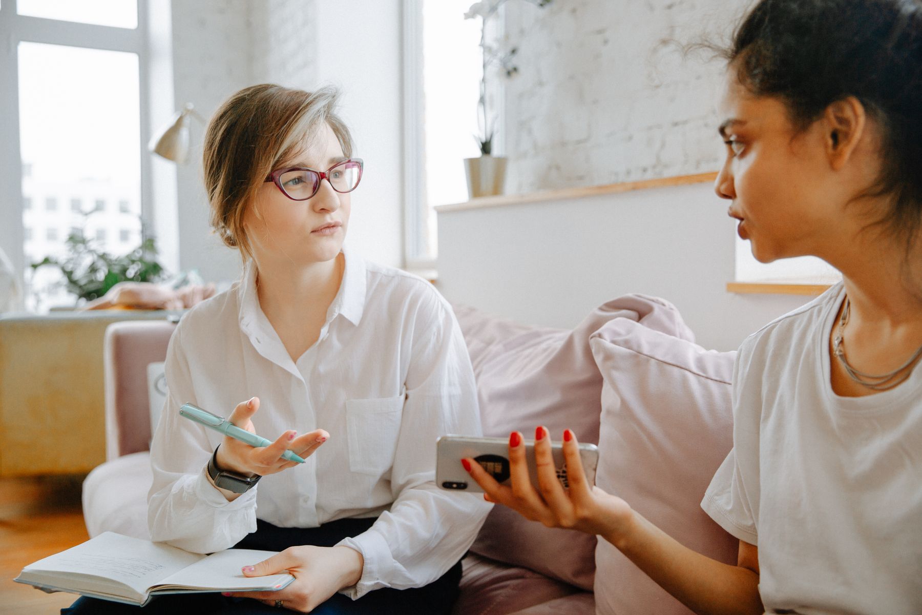 Two people discussing information during a consultation.